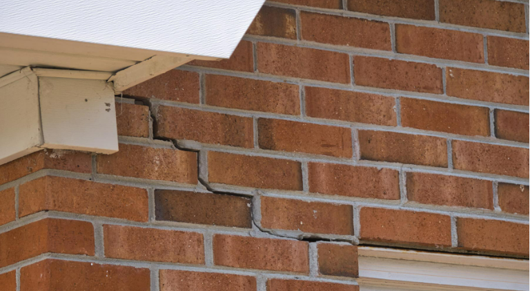 Step cracking on brick exterior. 